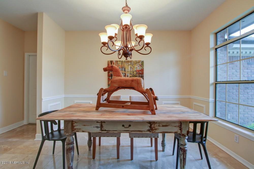 3038 Nautilus Road Middleburg, FL 32068 - Photo 38 of 45 a view of a dining room with furniture window and wooden floor
