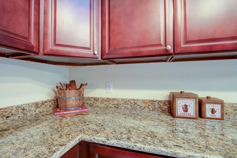 3038 Nautilus Road Middleburg, FL 32068 - Photo 44 of 45 a room with water heater and cabinets