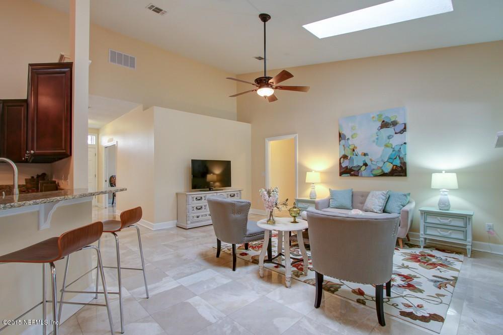 3038 Nautilus Road Middleburg, FL 32068 - Photo 7 of 45 a view of a livingroom with furniture and a flat screen tv