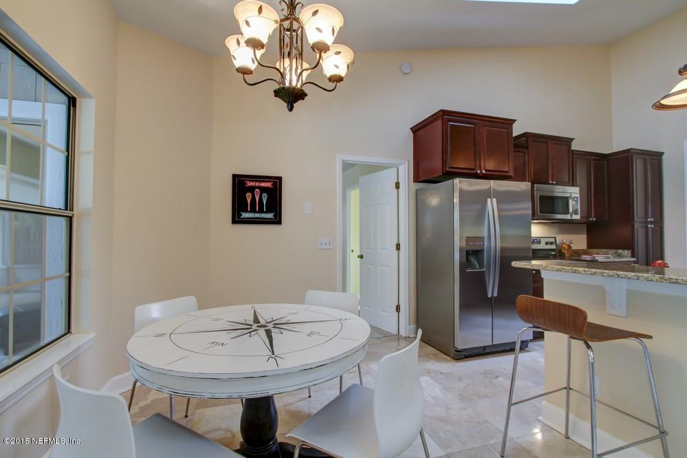 3038 Nautilus Road Middleburg, FL 32068 - Photo 9 of 45 a living room with stainless steel appliances furniture a chandelier and kitchen view