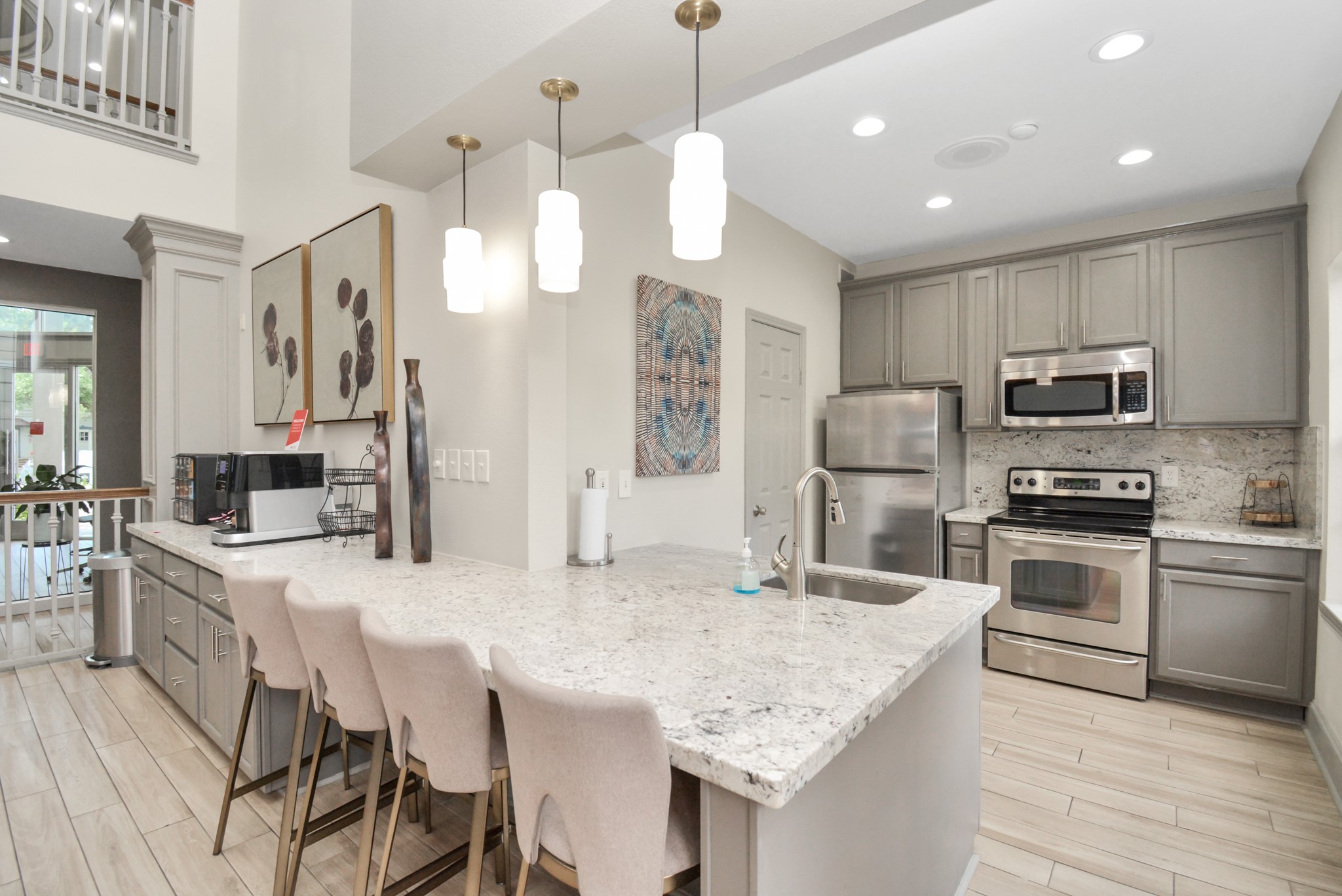 2222 Maroneal Street, Unit 1414 Houston, TX 77030 - Photo 3 of 15 a kitchen with stainless steel appliances granite countertop a kitchen island hardwood floor sink stove dining table and chairs