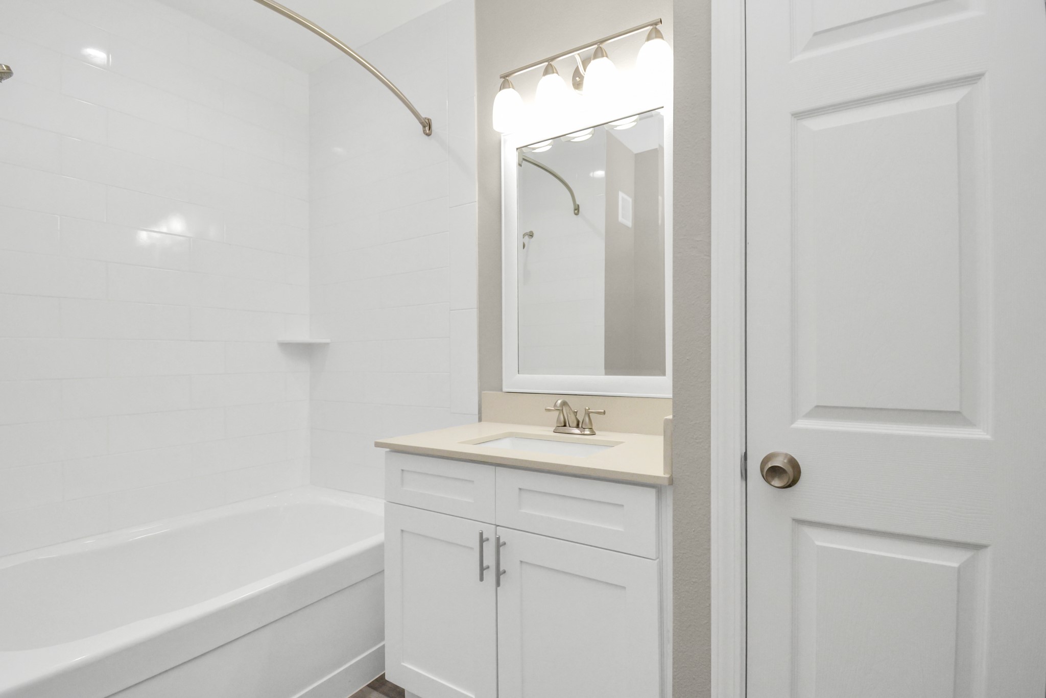 2222 Maroneal Street, Unit 1414 Houston, TX 77030 - Photo 12 of 15 a bathroom with a bathtub shower sink vanity and mirror