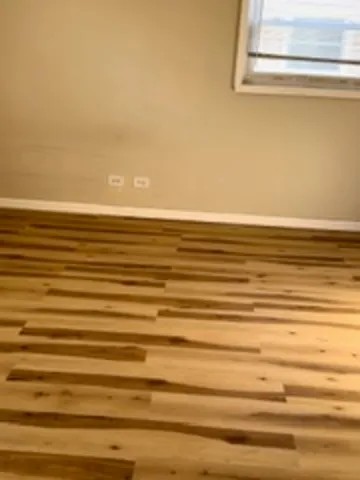 a view of a bathroom with a sink and a shower curtain