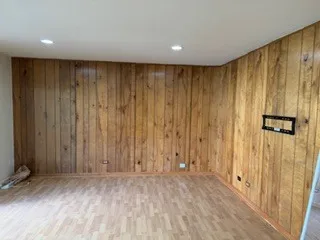 a view of hallway with a wooden door