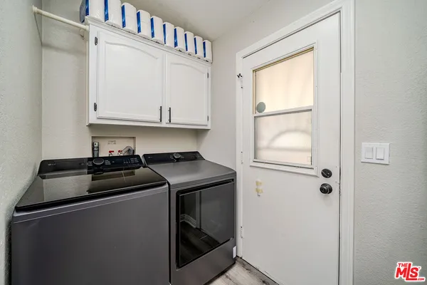 a kitchen with a stove and a refrigerator
