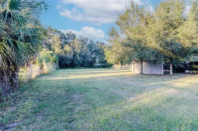 a view of a outdoor space and basketball court