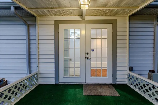 a kitchen with granite countertop a sink stove and cabinets