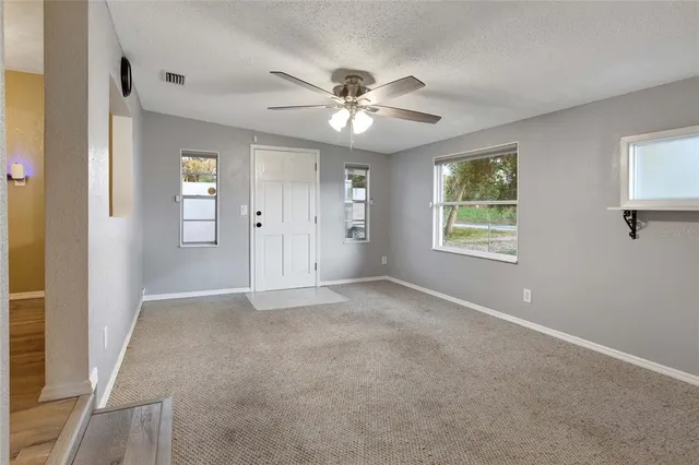 a bedroom with bed and wooden floor