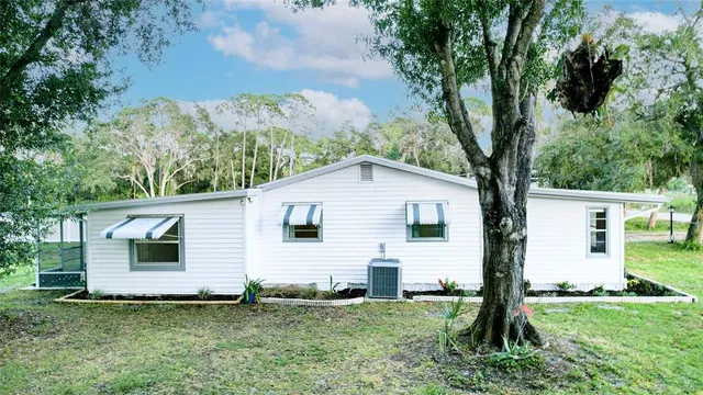 a front view of house with yard and seating area