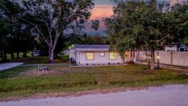 a view of a lush green hillside and a houses