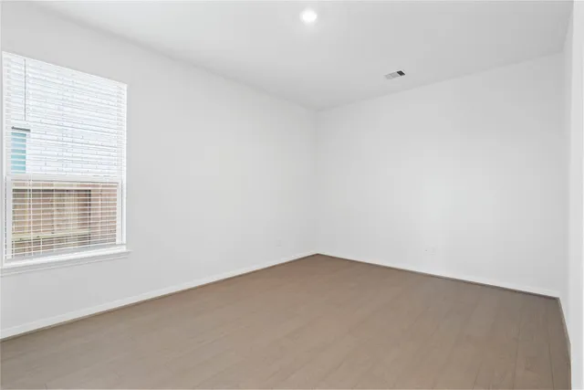 a view of a kitchen with a sink a refrigerator and a stove top oven