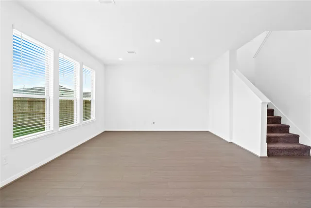 a view of kitchen with microwave and refrigerator
