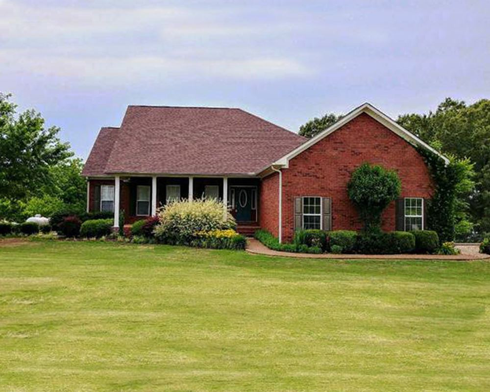 1495 Clifford Road Luray, TN 38352 - Photo 1 of 1 a front view of house with yard and green space