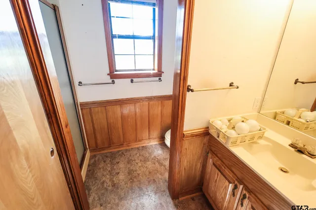 an empty room with windows and entrance