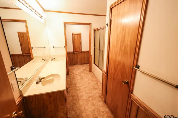 a view of a room with a wooden floor and a window