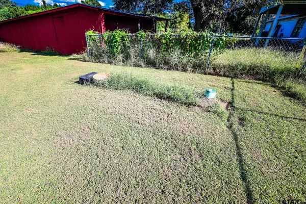 an aerial view of a house with big yard
