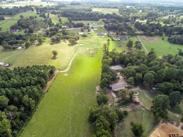 an aerial view of residential house with outdoor space
