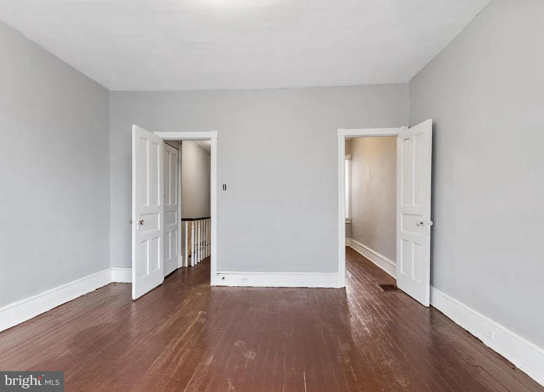 5224 Rodman Street Philadelphia, PA 19143 - Photo 9 of 12 an empty room with wooden floor & windows