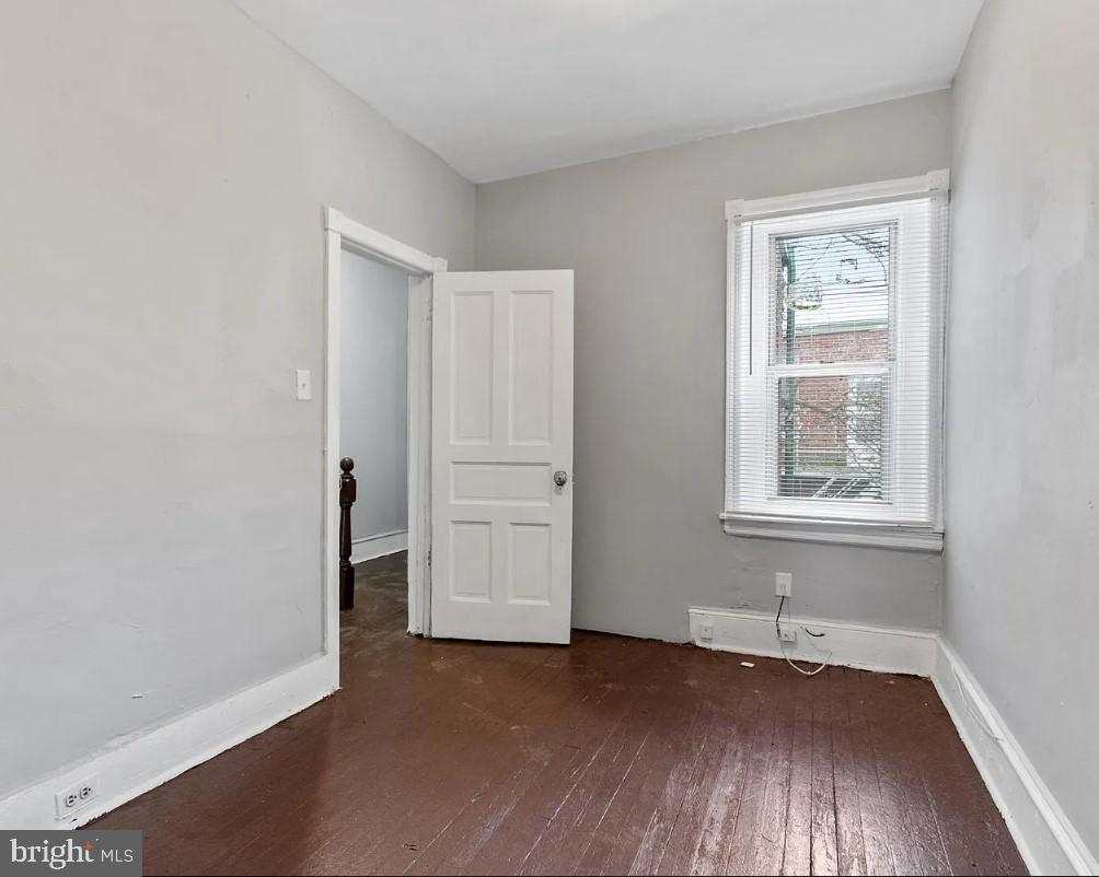 5224 Rodman Street Philadelphia, PA 19143 - Photo 10 of 12 an empty room with wooden floor and windows
