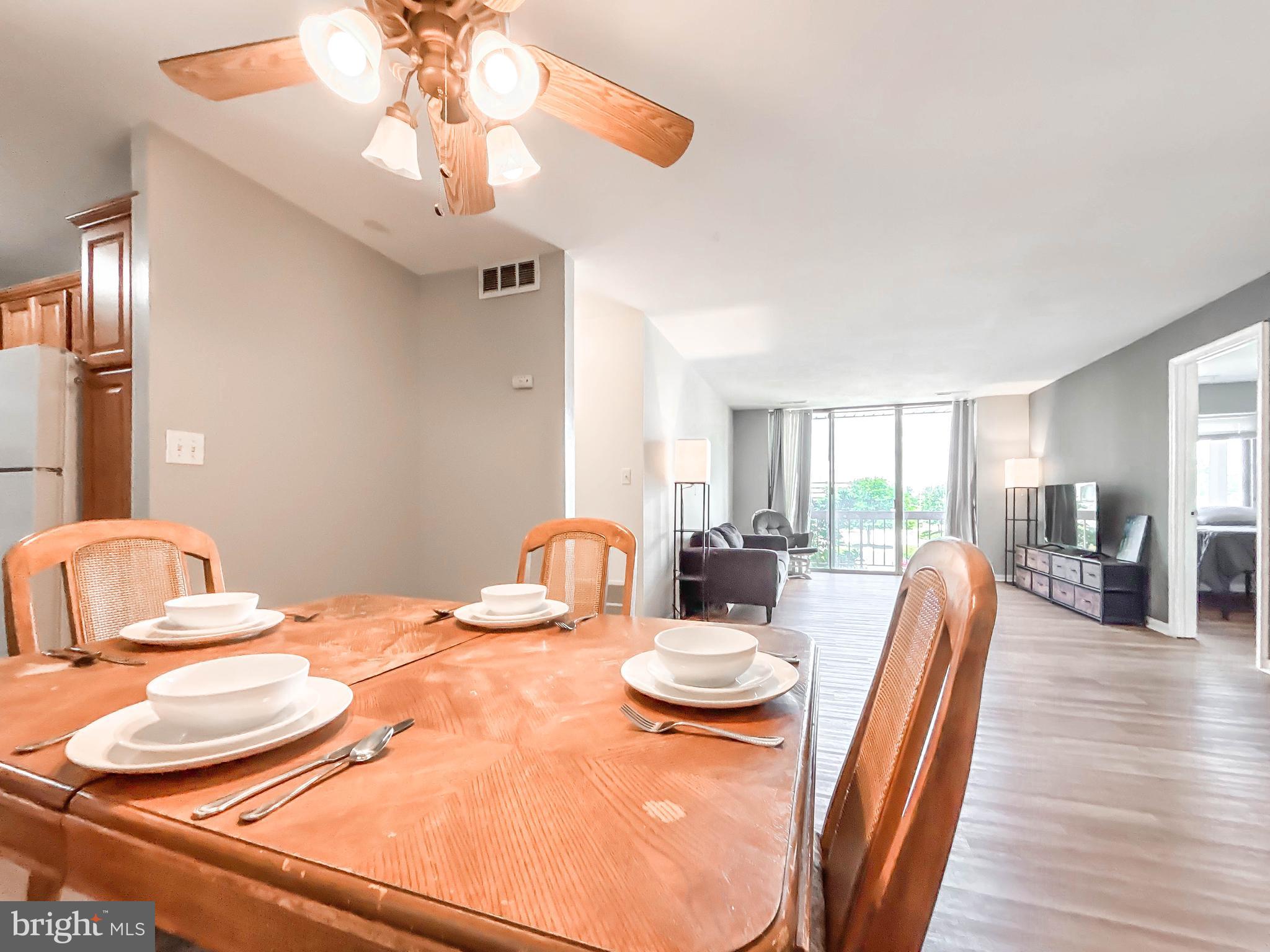 130 Slade Avenue, Unit 414 Baltimore, MD 21208 - Photo 43 of 48 a view of a dining room with furniture