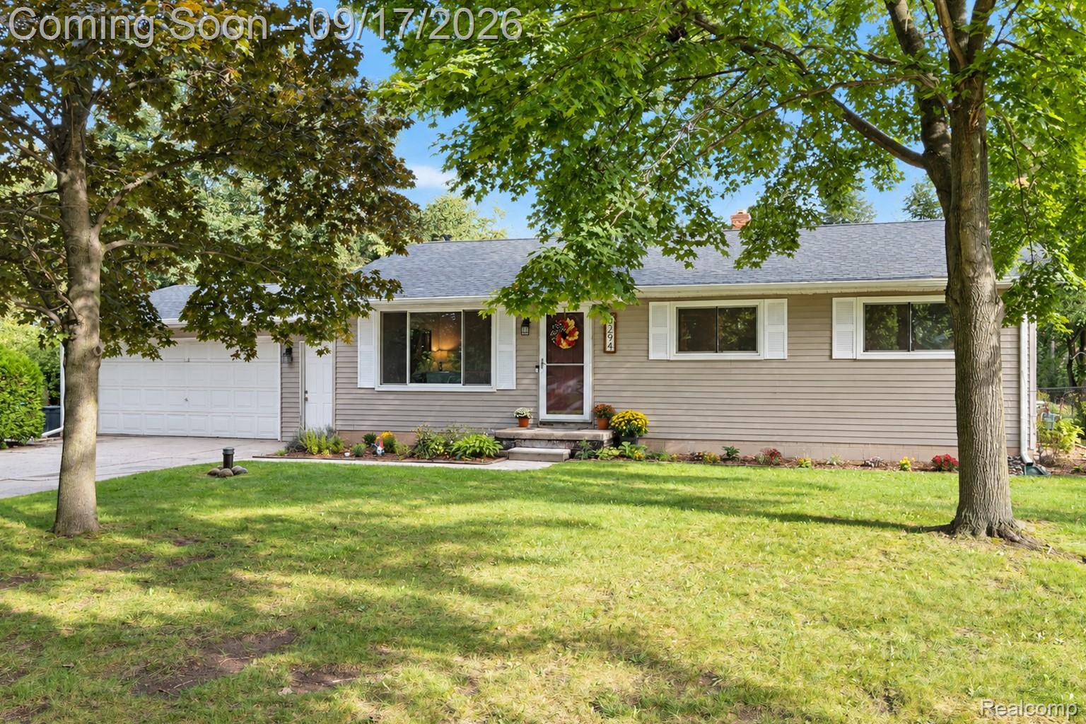 3294 Genoa Road Clarkston, MI 48346 - Photo 1 of 23 Single-story property with tan horizontal siding, white window trim, and a dark shingled roof