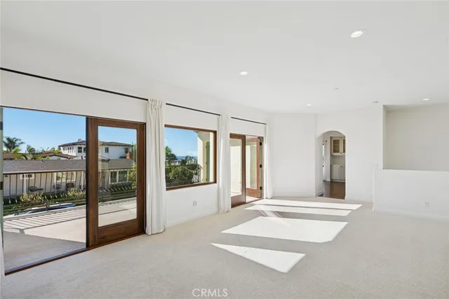 a view of an empty room with a balcony
