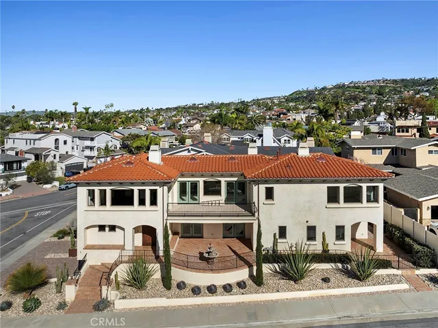 a front view of a residential apartment building with a yard