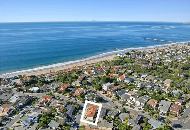 an aerial view of beach and ocean