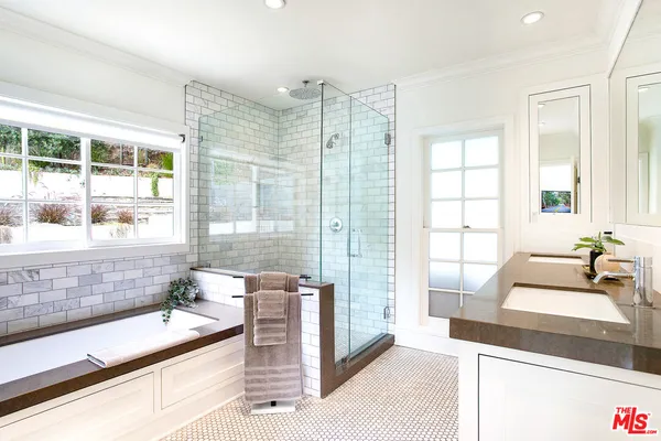 a kitchen with a sink and a large window