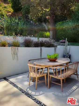 a patio with table and chairs