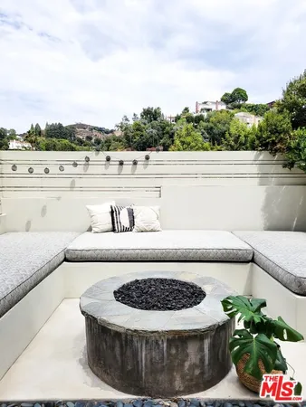 a view of a lake with a yard and large trees