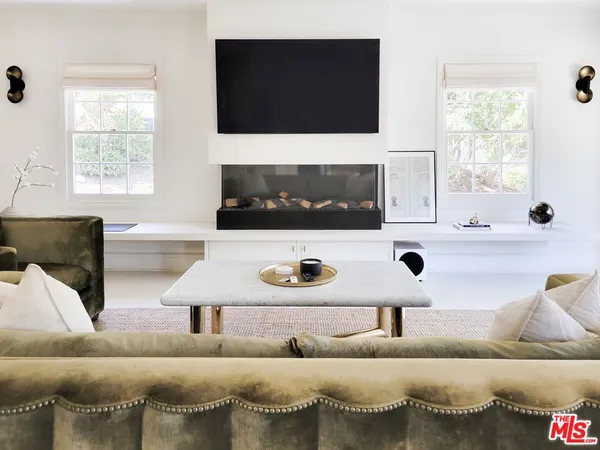 a living room with a couch and a flat screen tv