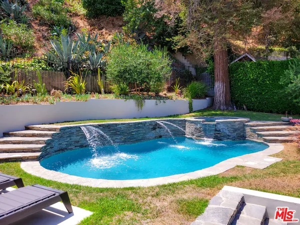a view of a swimming pool with a patio