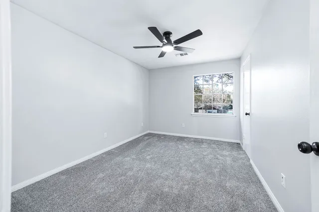 a bathroom with a sink toilet and a mirror