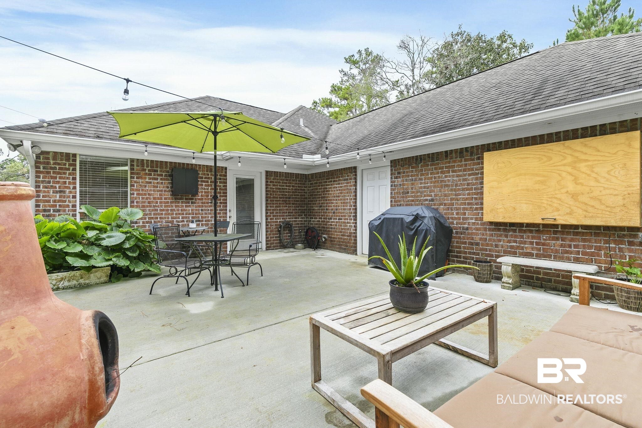 32072 Buzbee Road Daphne, AL 36527 - Photo 25 of 41 View of patio featuring a grill and an outdoor living space