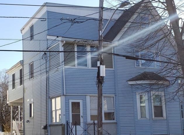 52 Malden Street, Unit 2 Malden, MA 02148 - Photo 2 of 8 a front view of a house with a garage