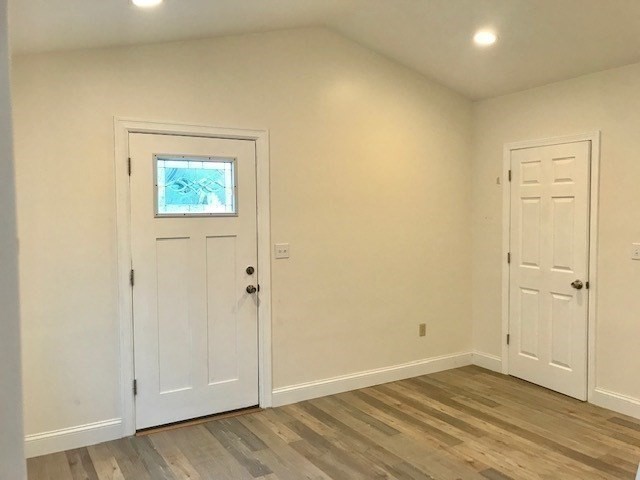52 Malden Street, Unit 2 Malden, MA 02148 - Photo 6 of 8 an empty room with wooden floor and closet area