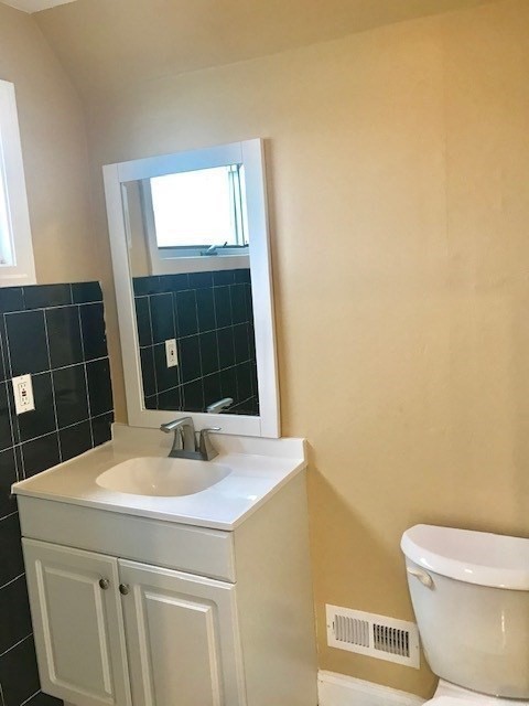 52 Malden Street, Unit 2 Malden, MA 02148 - Photo 7 of 8 a bathroom with a sink and a toilet