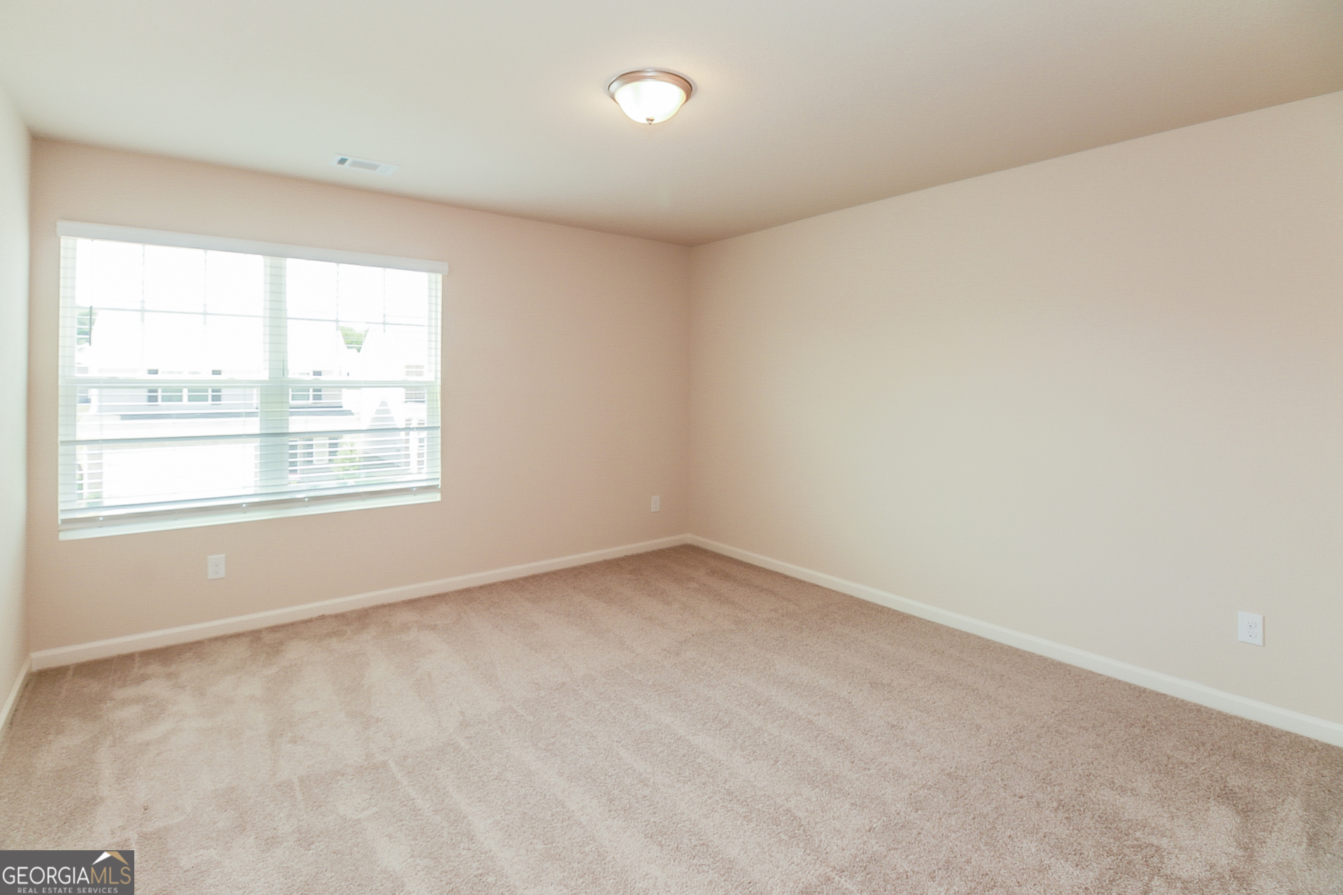 10902 Wheeler Trace Hampton, GA 30228 - Photo 11 of 17 an empty room with a window
