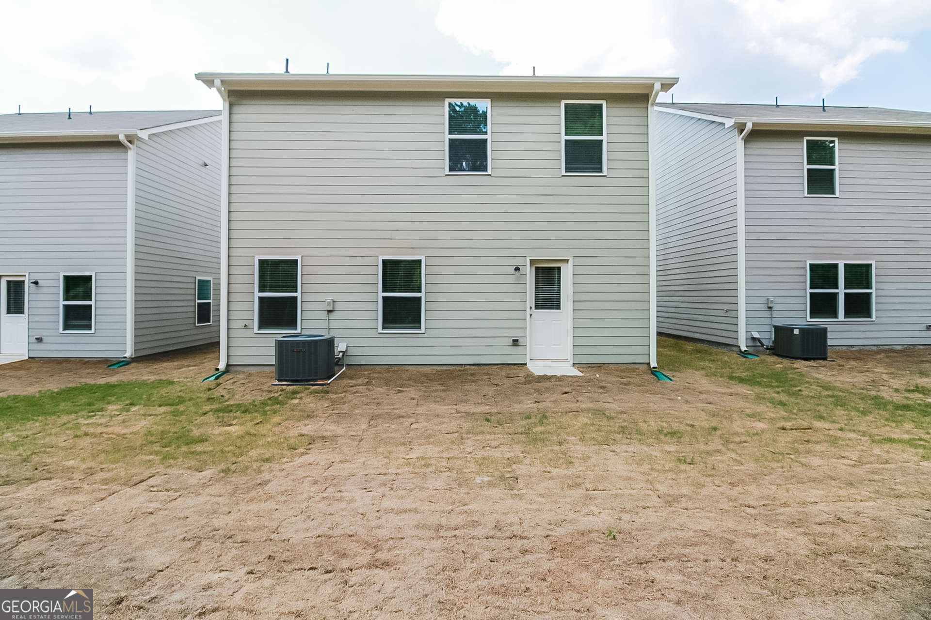 10902 Wheeler Trace Hampton, GA 30228 - Photo 15 of 17 a view of a house with a yard