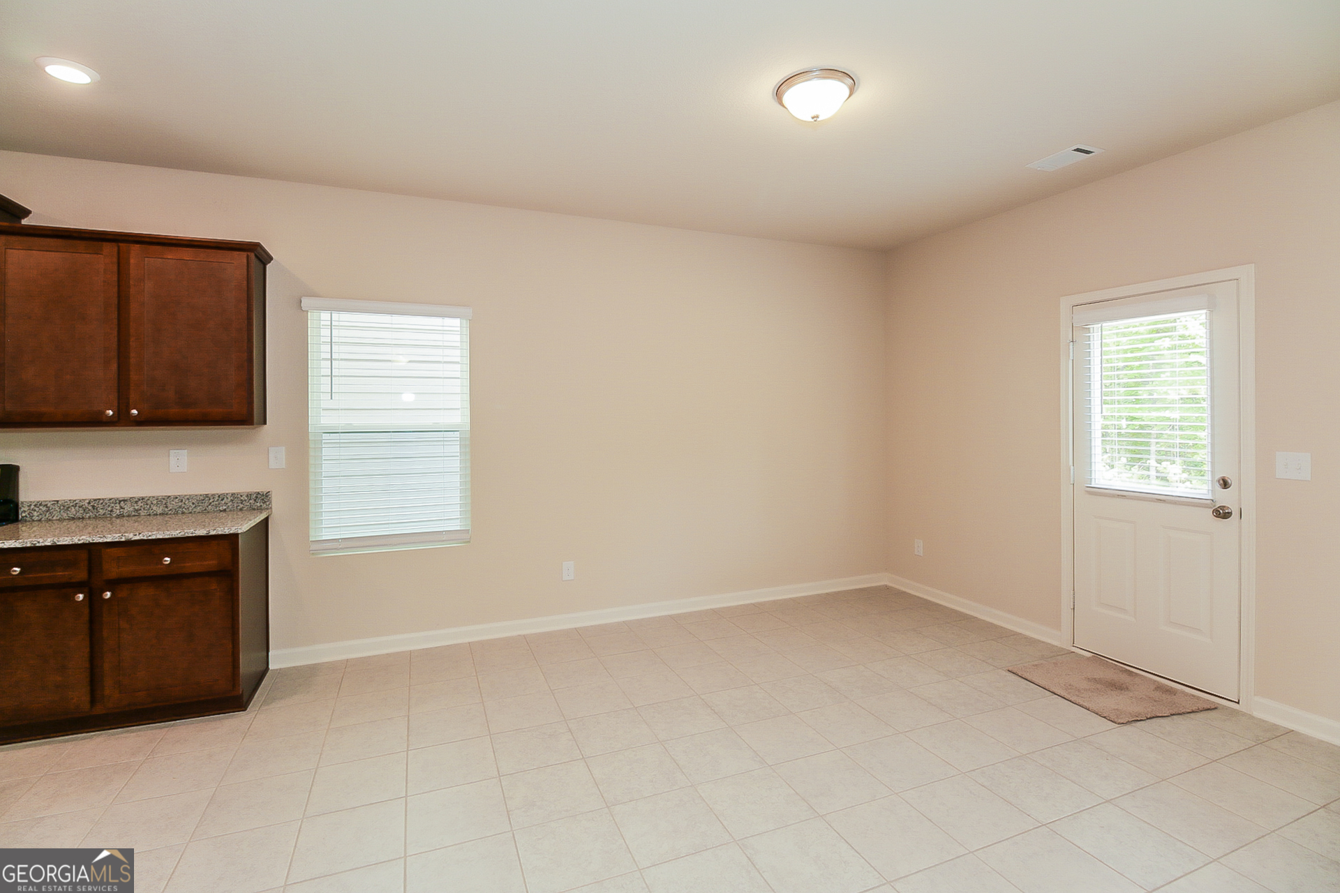 10902 Wheeler Trace Hampton, GA 30228 - Photo 4 of 17 an empty room with windows