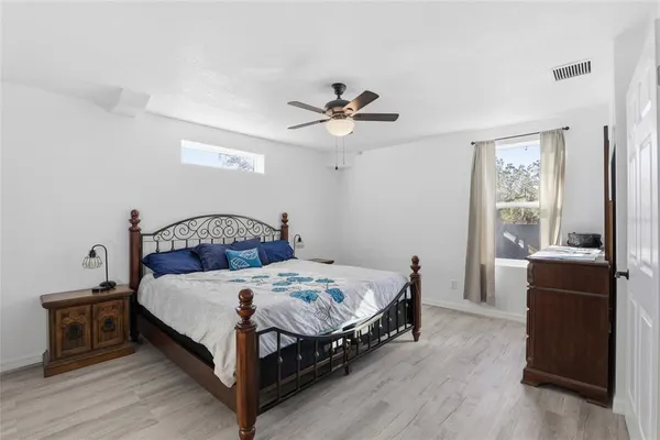 a bedroom with a bed and a table
