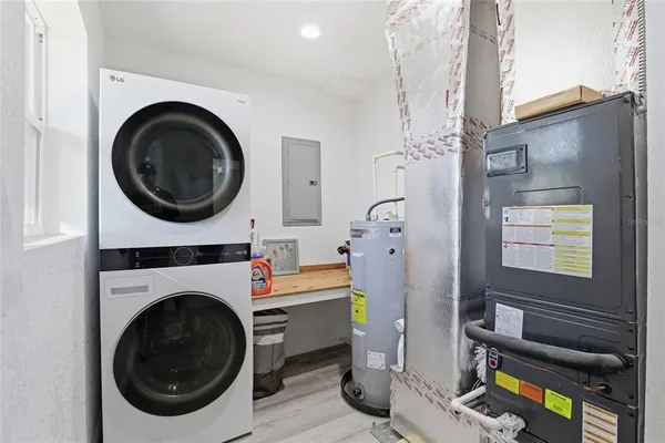 a view of a bedroom with washer and dryer