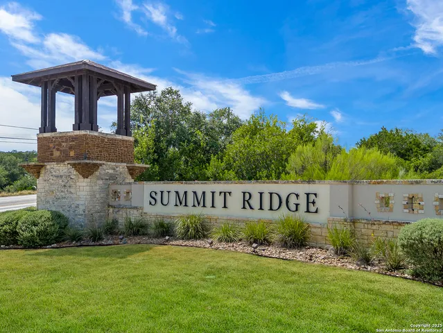 an aerial view of a house with outdoor space