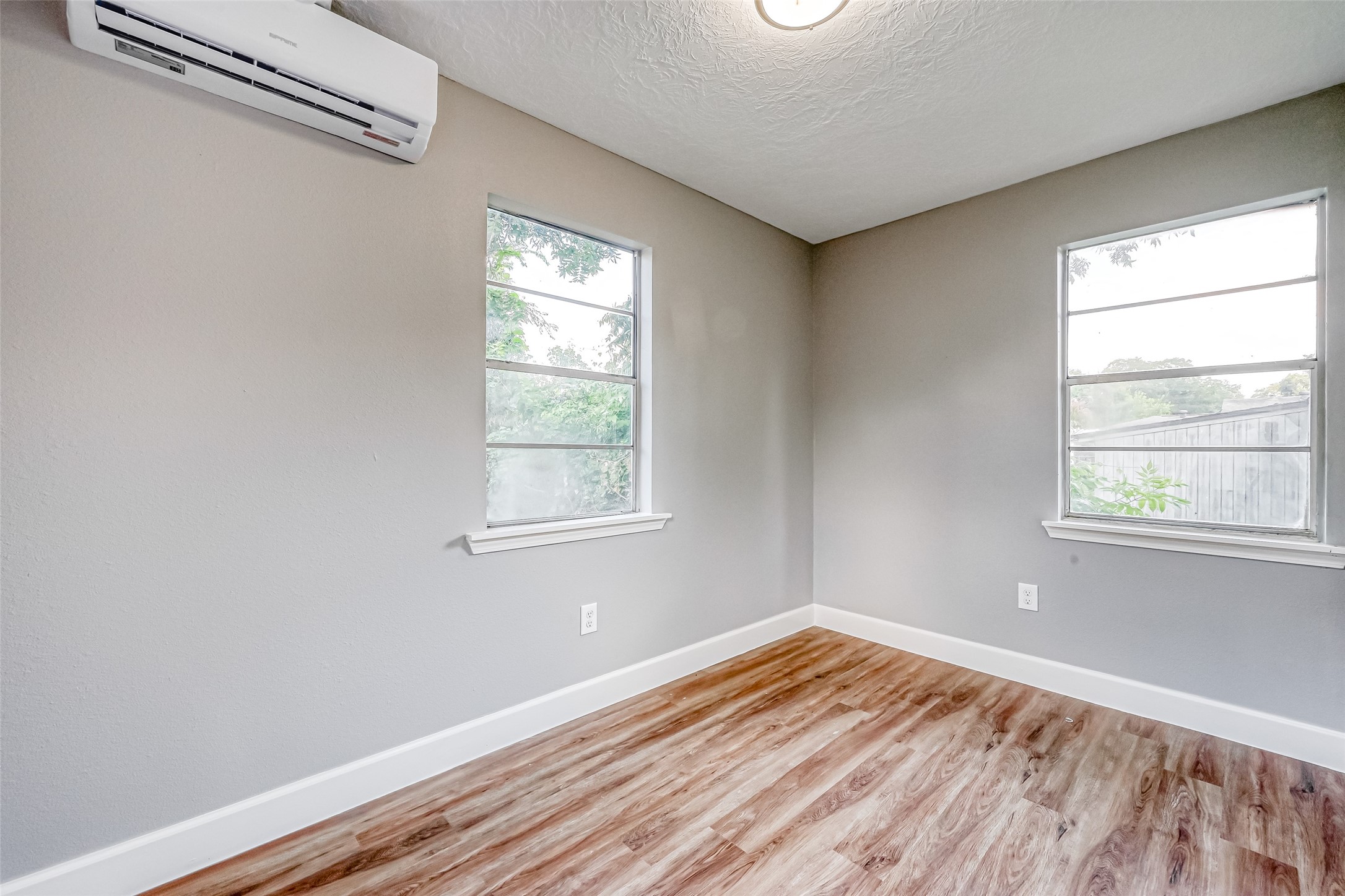 6715 Victoria Street Houston, TX 77020 - Photo 32 of 46 a view of empty room with wooden floor and fan
