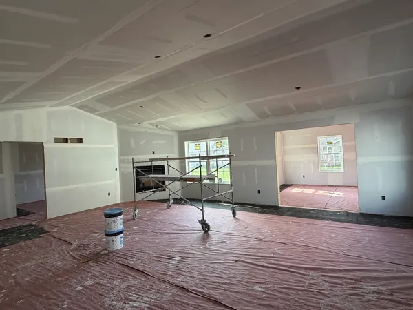 a living room with furniture window and wooden floor
