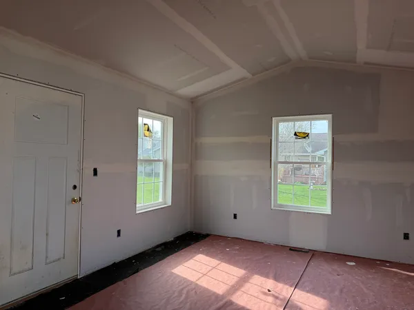 an empty room with windows