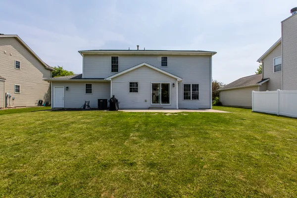 a front view of house with garden