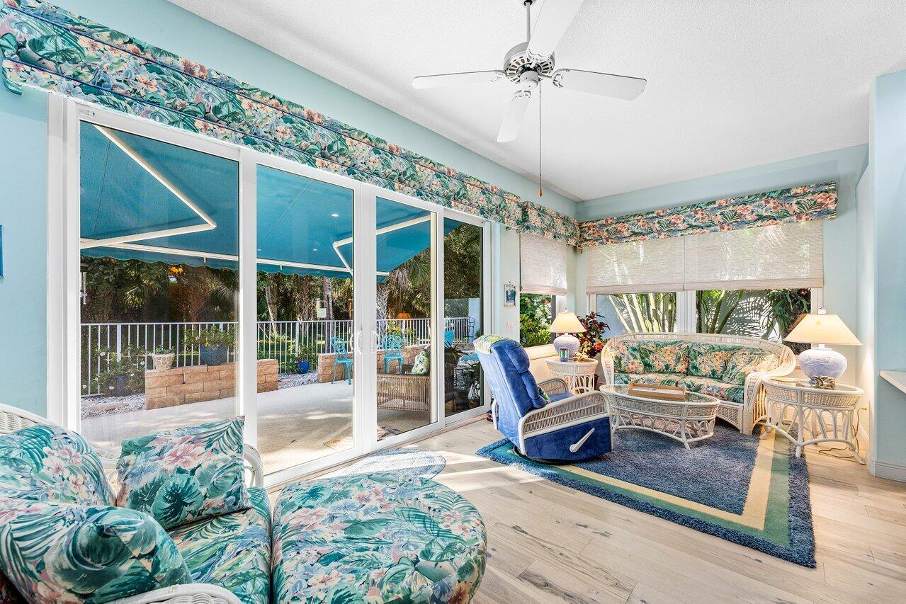 198 Hampton Circle Jupiter, FL 33458 - Photo 11 of 32 a living room with furniture and a large window