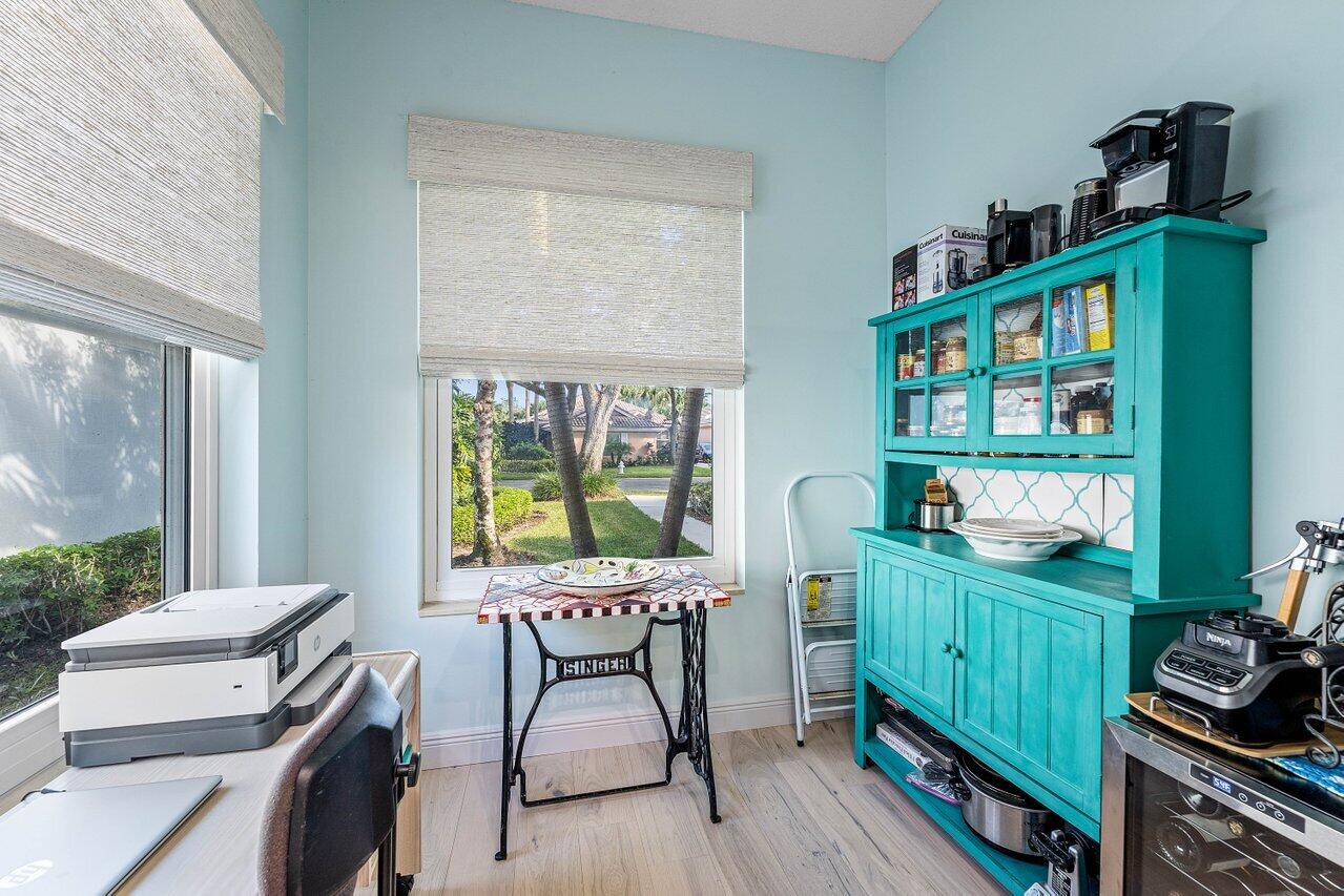 198 Hampton Circle Jupiter, FL 33458 - Photo 18 of 32 a workspace with furniture and a window